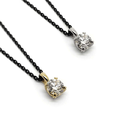 Two 0.50ct lab diamond pendants in 14kt yellow and white gold on black chains