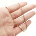 Vintage 10kt yellow gold twist chain necklace shown draped on hand