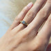 14K yellow gold lab diamond engagement ring worn on hand, showing woven band design