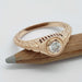 14k rose gold bezel set diamond ring with filigree, hand engraving and millgrain on a pencil