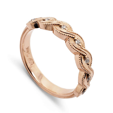 14k rose gold wedding band with twisted millgrain and pave diamonds