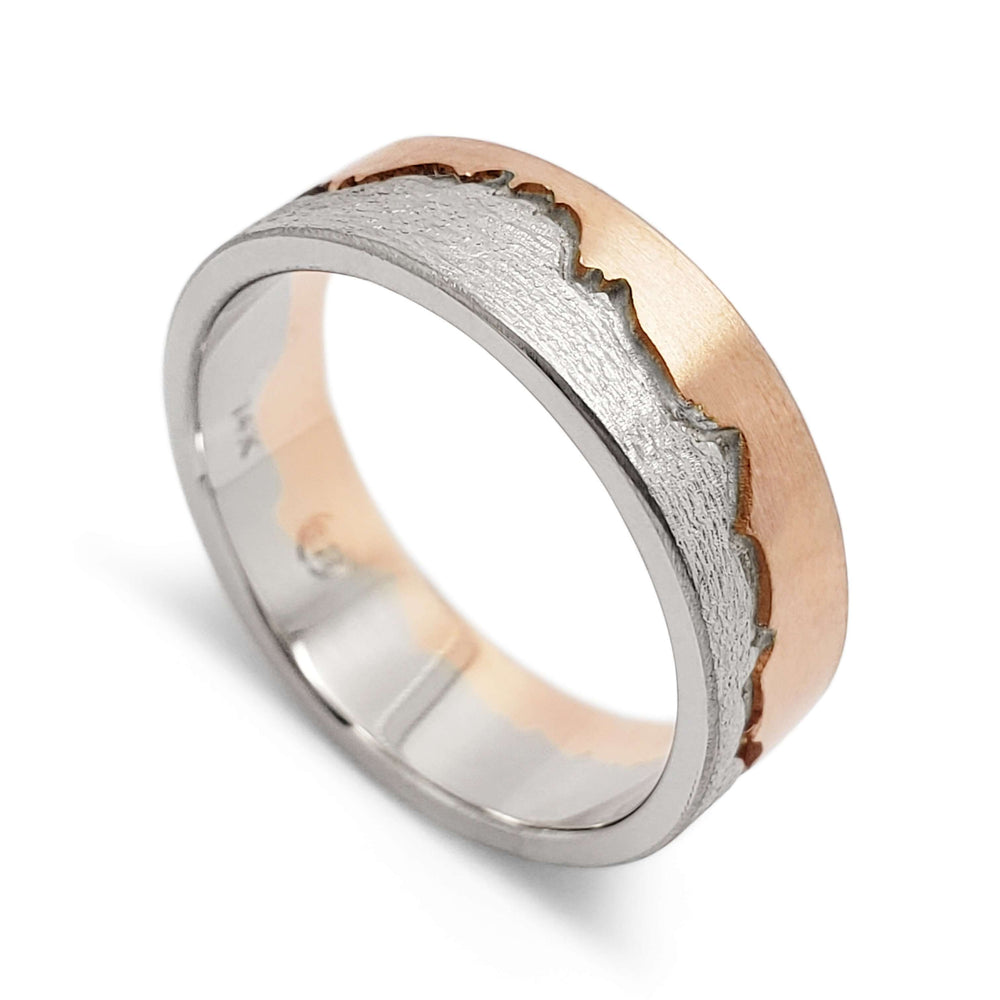 14k white and rose gold mountain range wedding ring with textured finish