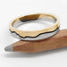 14k white and yellow gold mountain range wedding ring with blackened groove on pencil