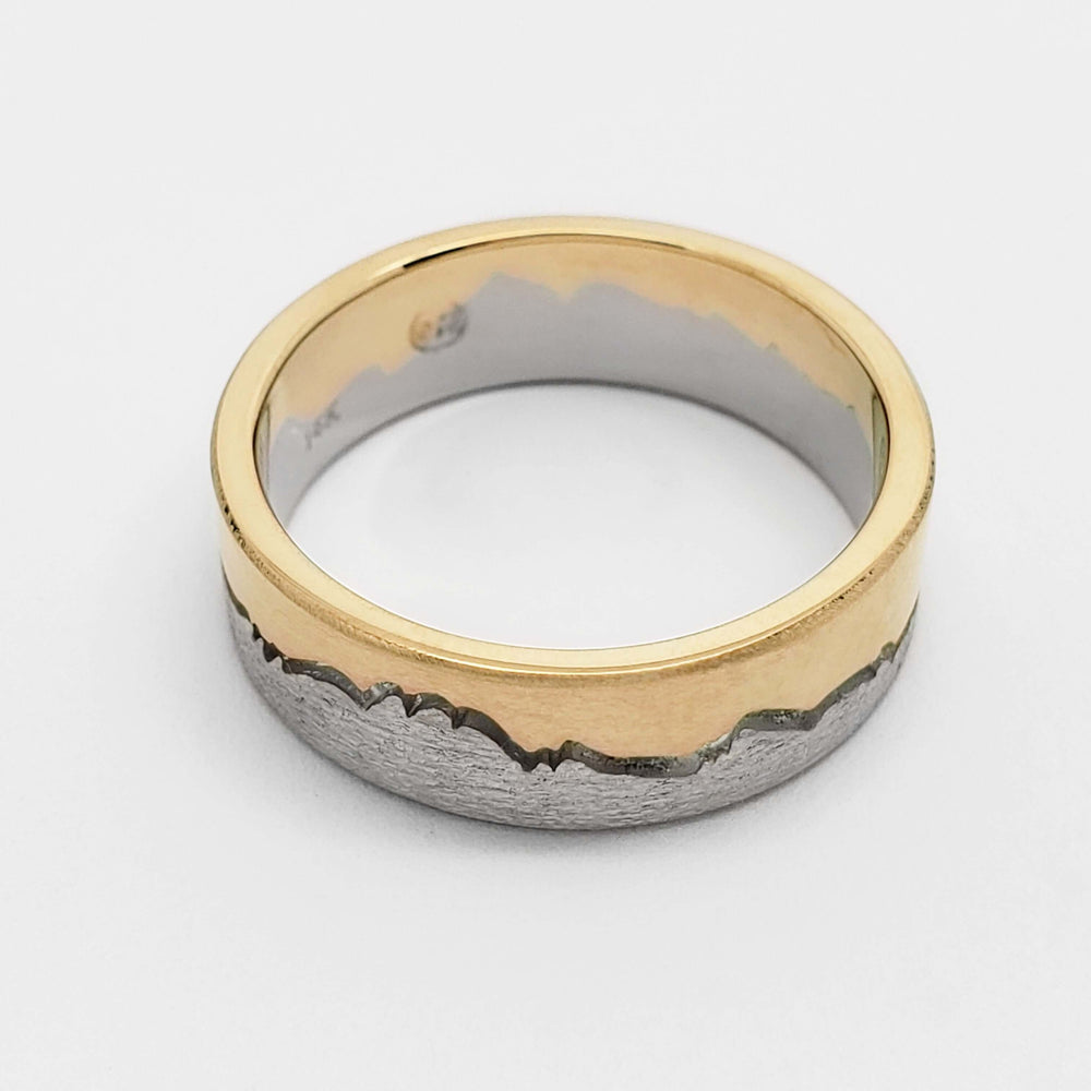 14k white and yellow gold mountain range wedding ring with brushed and hammered textures