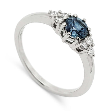 14k white gold ring with round blue Montana sapphire and six accent diamonds
