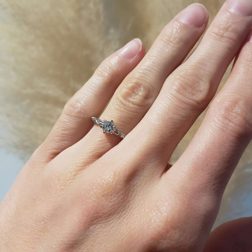 14k white gold antique diamond engagement ring shown on hand