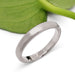 14k white gold brushed wedding ring displayed with a green leaf background