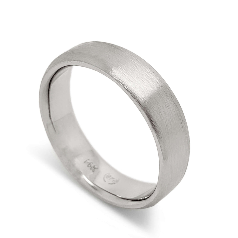 14k white gold flat wedding ring with brushed finish, angled view