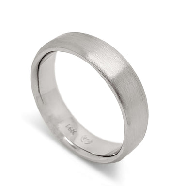 14k white gold flat wedding ring with brushed finish, angled view