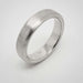 14k white gold flat wedding ring with brushed finish, side angle