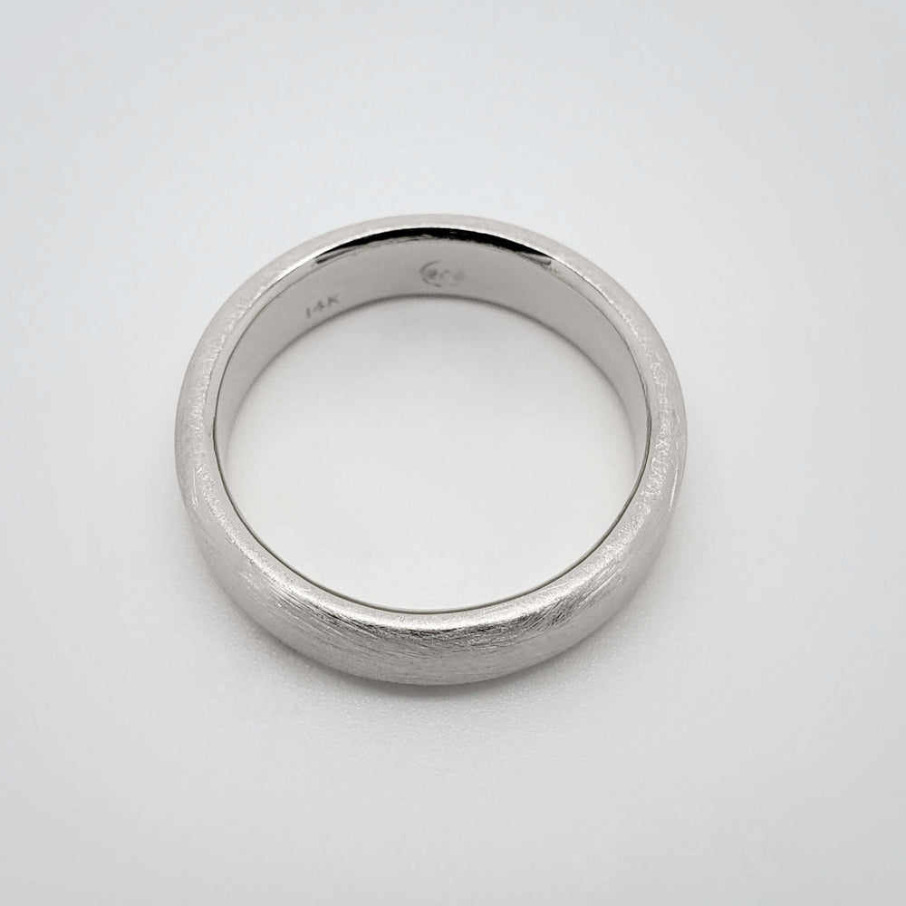 14k white gold flat wedding ring with brushed finish, top view