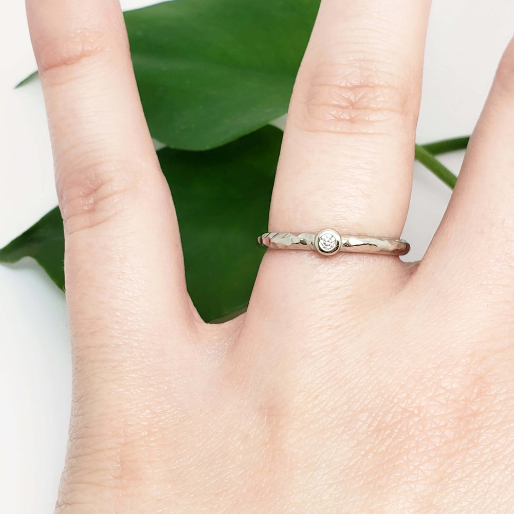 14k white gold hammered diamond ring worn on hand