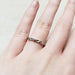 14k white gold leaf and diamond wedding ring shown on a hand