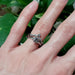 14k white gold leafy diamond wedding ring stacked with solitaire engagement ring