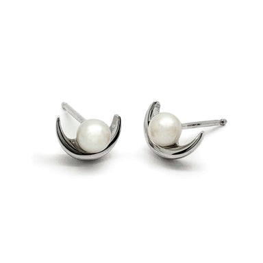 Pair of 14k white gold stud earrings with round pearls and crescent moon design