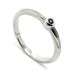 14k white gold stacking ring with bezel-set blue sapphire and millgrain detail
