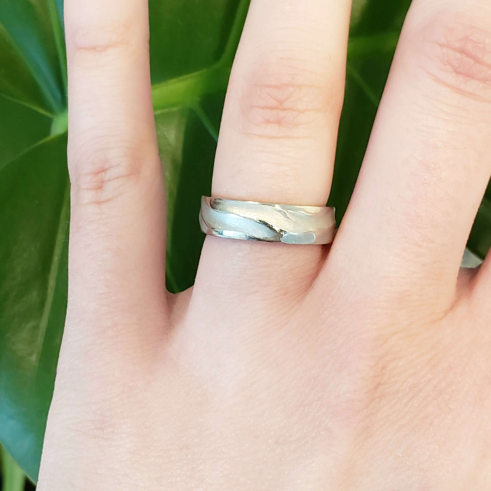 14k white gold topography textured wedding ring worn on hand