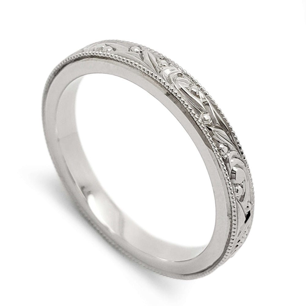 14k white gold wedding ring with hand engraving and millgrain detail