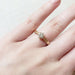 14k yellow gold Canadian diamond engagement ring with wheat engraving shown on hand