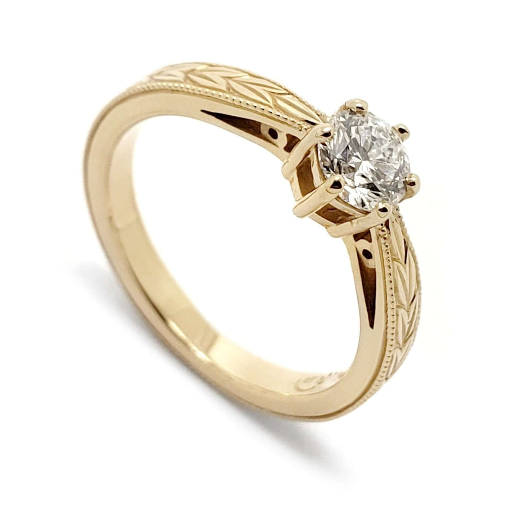 14k yellow gold engagement ring with round Canadian diamond and wheat engraving