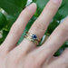 14k yellow gold engraved wedding band stacked with sapphire and diamond rings on hand