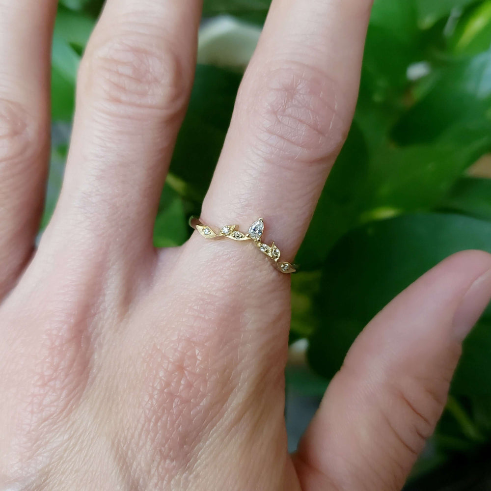 14k yellow gold leaf diamond wedding ring on hand, single band