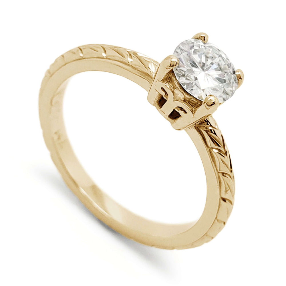 14k yellow gold engagement ring with round moissanite and wheat engraving on band