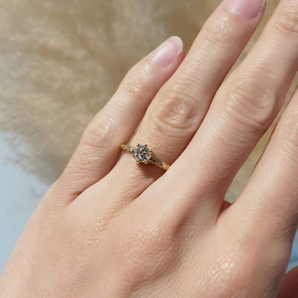 14k yellow gold old mine cut diamond ring shown on hand
