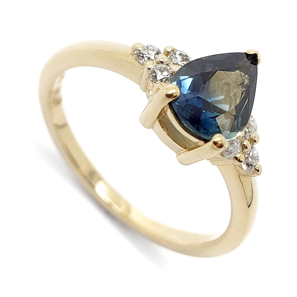 14k yellow gold ring with pear-cut blue Australian sapphire and Canadian diamonds, close up