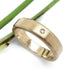 14k yellow gold wedding band with a single flush-set Canadian diamond, brushed texture