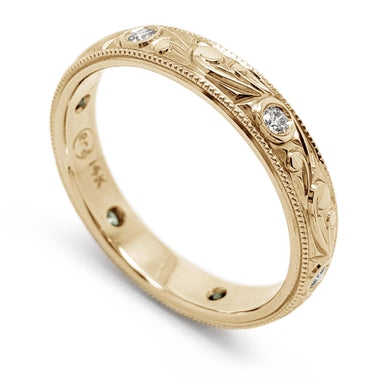 14k yellow gold wedding ring with engraved scrollwork and flush-set diamonds