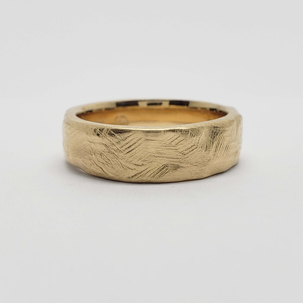 14k yellow gold wedding ring with a soft square shape and textured surface