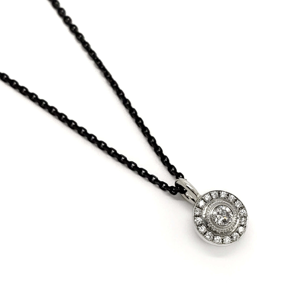 14kt white gold pendant with Canadian diamond halo on dark chain, top view