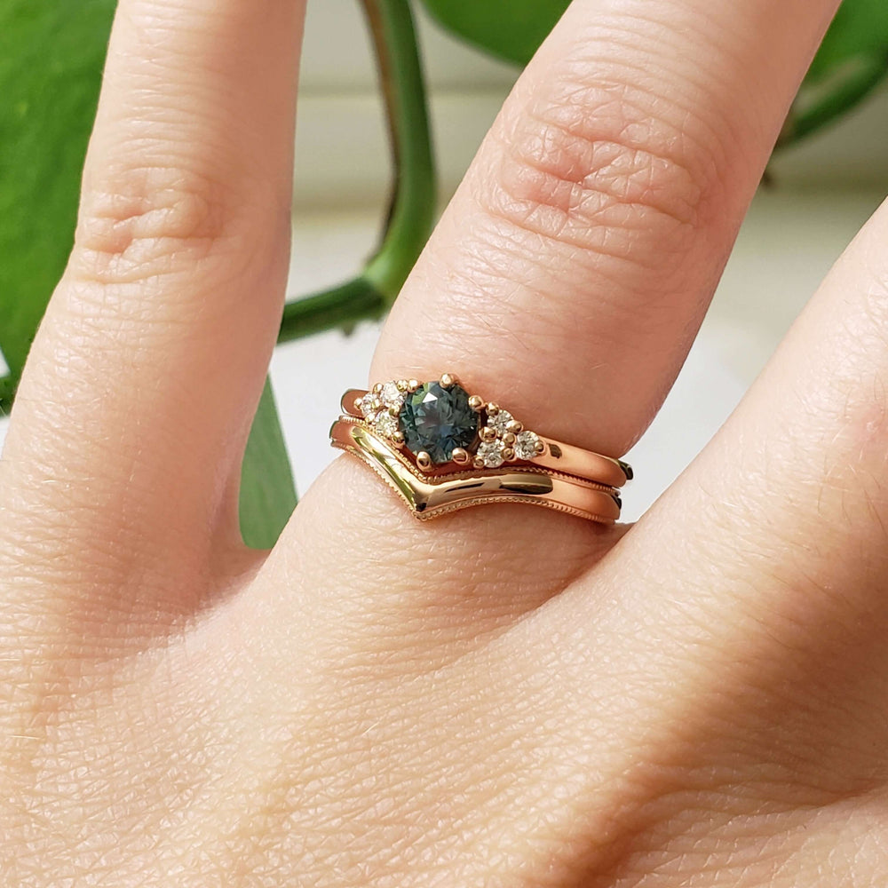 14kt rose gold chevron wedding band stacked with engagement ring and band on hand