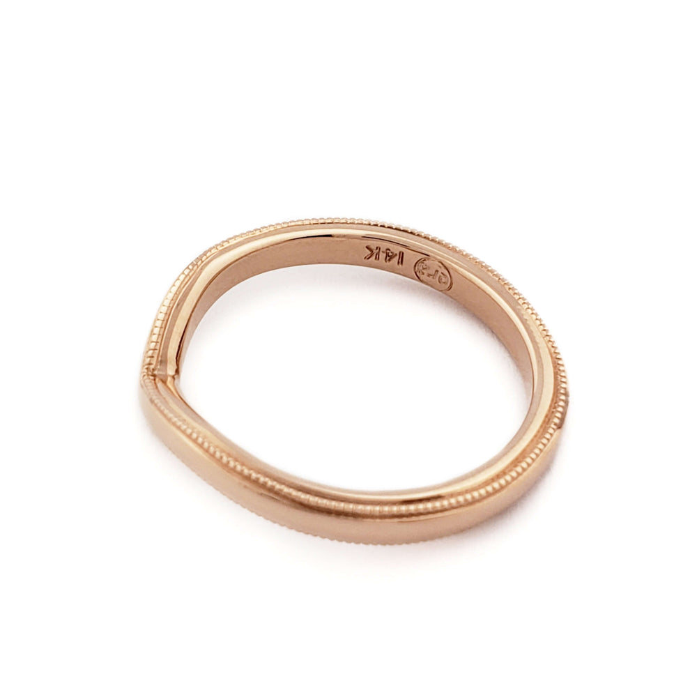 14kt rose gold chevron wedding band with millgrain, viewed from above