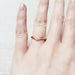 14kt rose gold chevron wedding ring worn on a hand