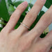 14kt rose gold diamond pave wedding ring on hand, single band