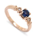 14kt rose gold engagement ring with round blue Montana sapphire and two accent diamonds
