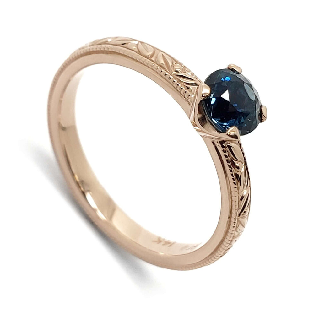 14kt rose gold engagement ring with round blue Australian sapphire, engraved and millgrain band