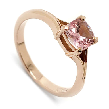 14kt rose gold engagement ring with cushion cut pink sapphire in four-claw setting