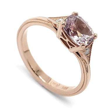14kt rose gold engagement ring with cushion cut pink sapphire and diamond accents