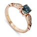14kt rose gold engagement ring with cushion teal Montana sapphire and Canadian diamonds in leafy setting