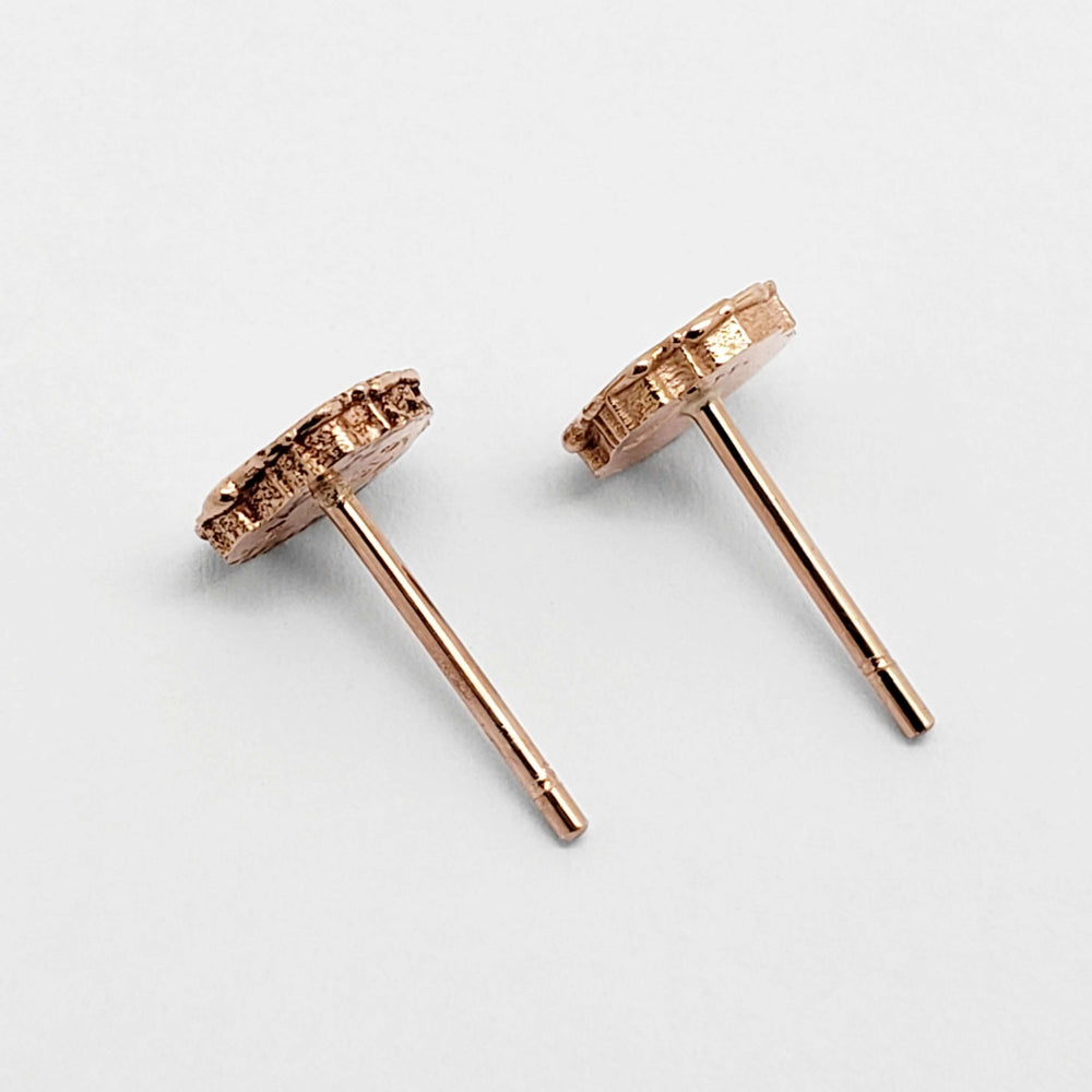 Back view of 14kt rose gold floral stud earrings showing earring posts