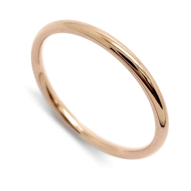 Simple 14kt rose gold wedding ring with a polished low dome profile