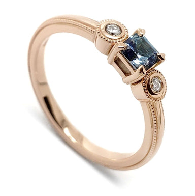 14kt rose gold ring with asscher cut blue Montana sapphire and two round Canadian diamonds