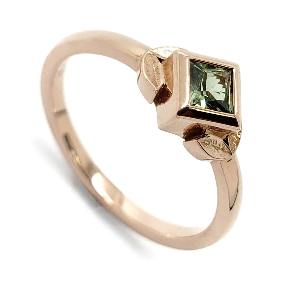 14kt rose gold ring with princess cut green lab-grown sapphire and leaf details