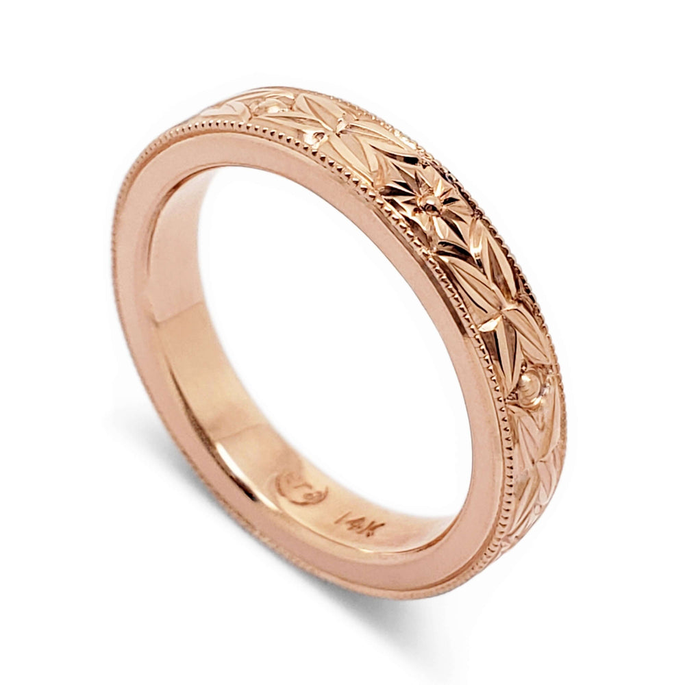 14kt rose gold wedding ring with floral hand engraving and millgrain detail
