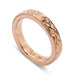 14kt rose gold wedding ring with floral hand engraving and millgrain detail