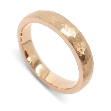 14kt rose gold wedding ring with hammered and brushed texture on white background