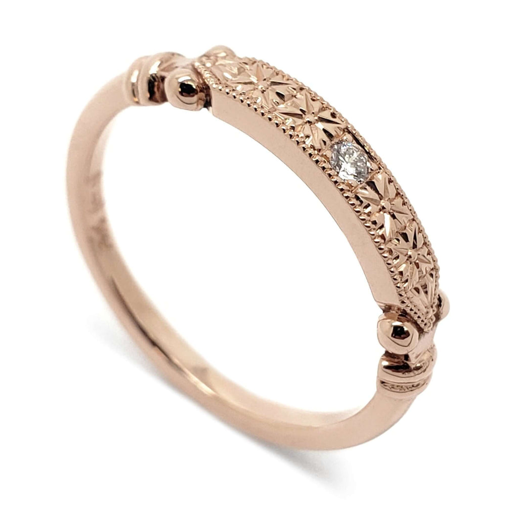 14kt rose gold wedding ring with hand engraving, millgrain, and a bead-set lab diamond